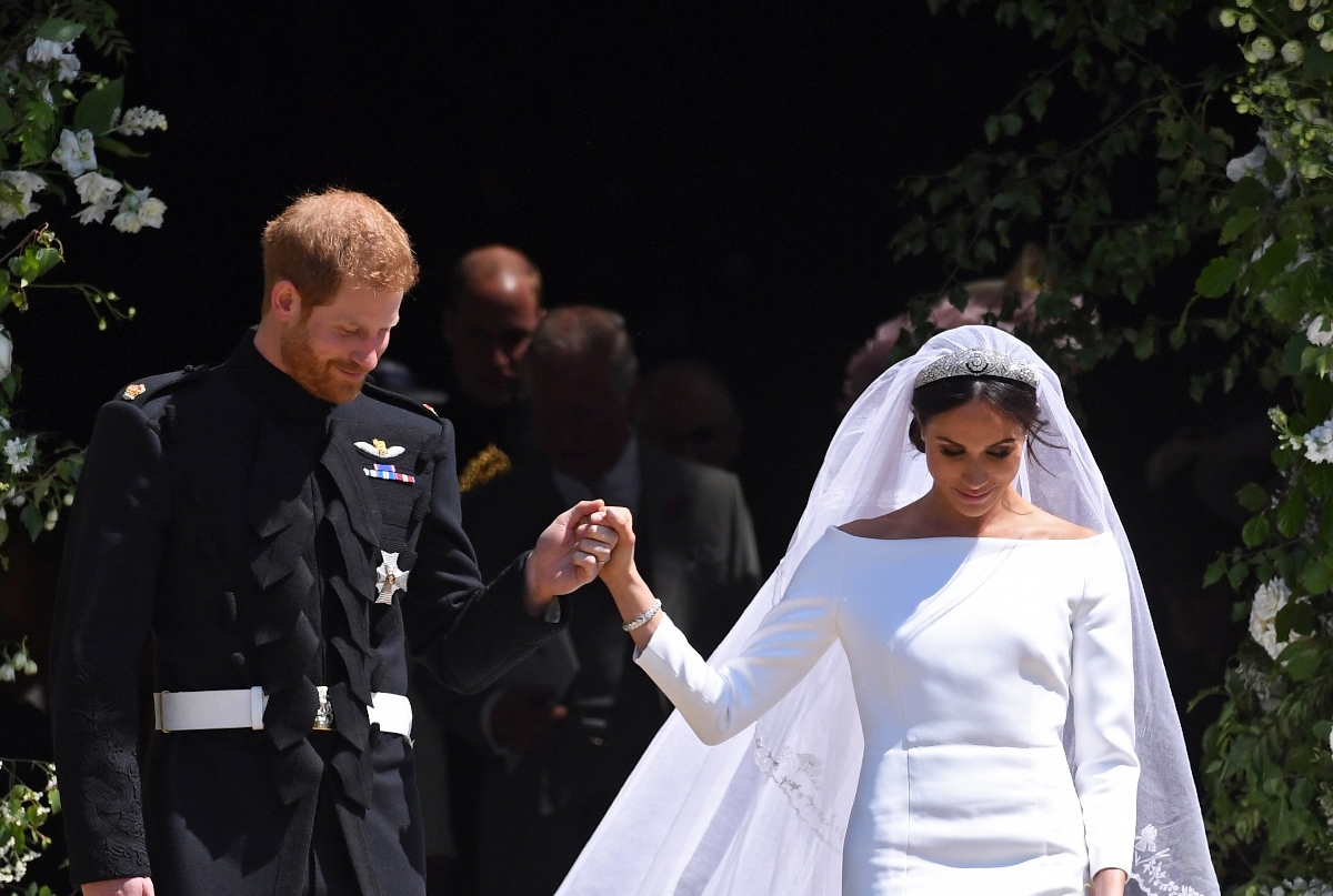 Windsor, 2018. május 19. Harry herceg, a brit trónörökös, Károly herceg másodszülött fia és Meghan Markle amerikai színésznő távozik egyházi esküvőjük után a windsori kastély Szent György-kápolnájából 2018. május 19-én.